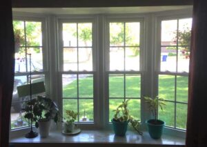 Interior view of white, four lite bay window with Double Hung windows