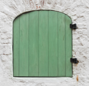 Small, single, green wooden shutter.