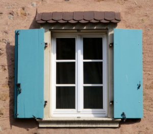 Small, blue, solid wooden shutters.