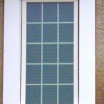 Casement windows with Obscrure glass and grids in white.
