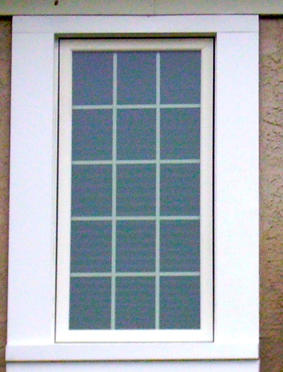 Casement windows with Obscure glass and grids in white.