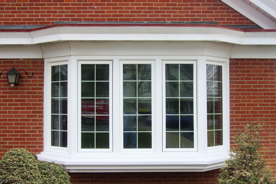 Exterior view of Bow Window with Grids on Red Brick Home