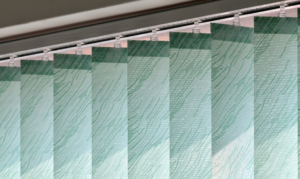 Close up of green, textured vertical blinds.